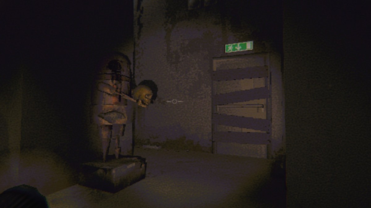 Looking at a semibot statue holding a skull, next to a boarded-up fire exit door