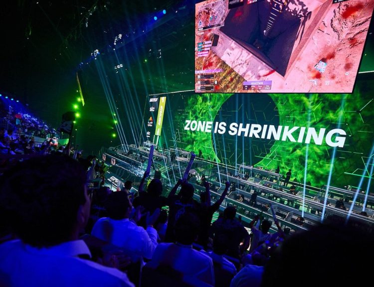 Raucous crowd and vibrant stage at the Warzone Esports World Cup.