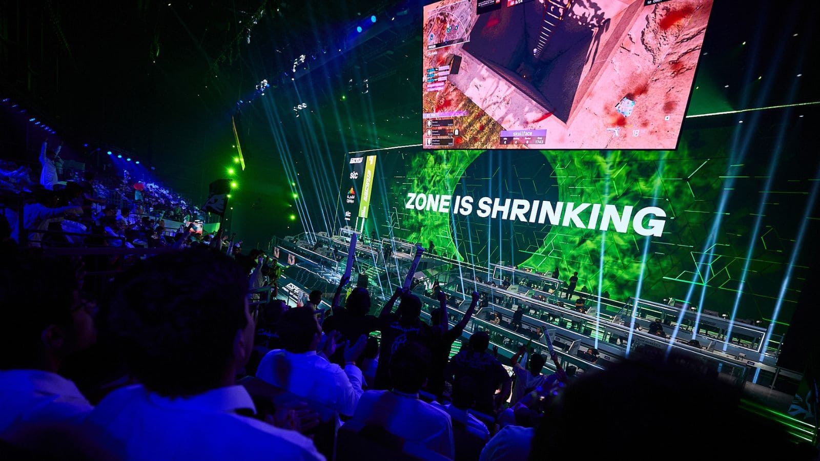 Raucous crowd and vibrant stage at the Warzone Esports World Cup.