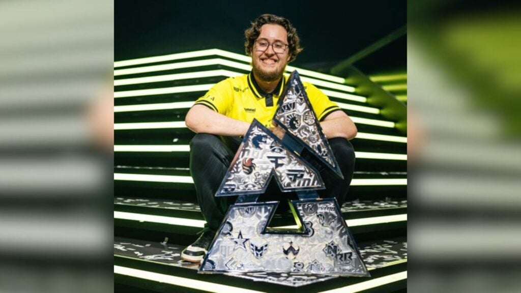 ZywOo is all smiles as he poses with the BLAST Austin Major trophy on the stage.