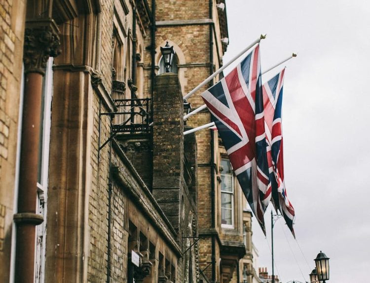 Picture showing hanging UK Flags outside a building.