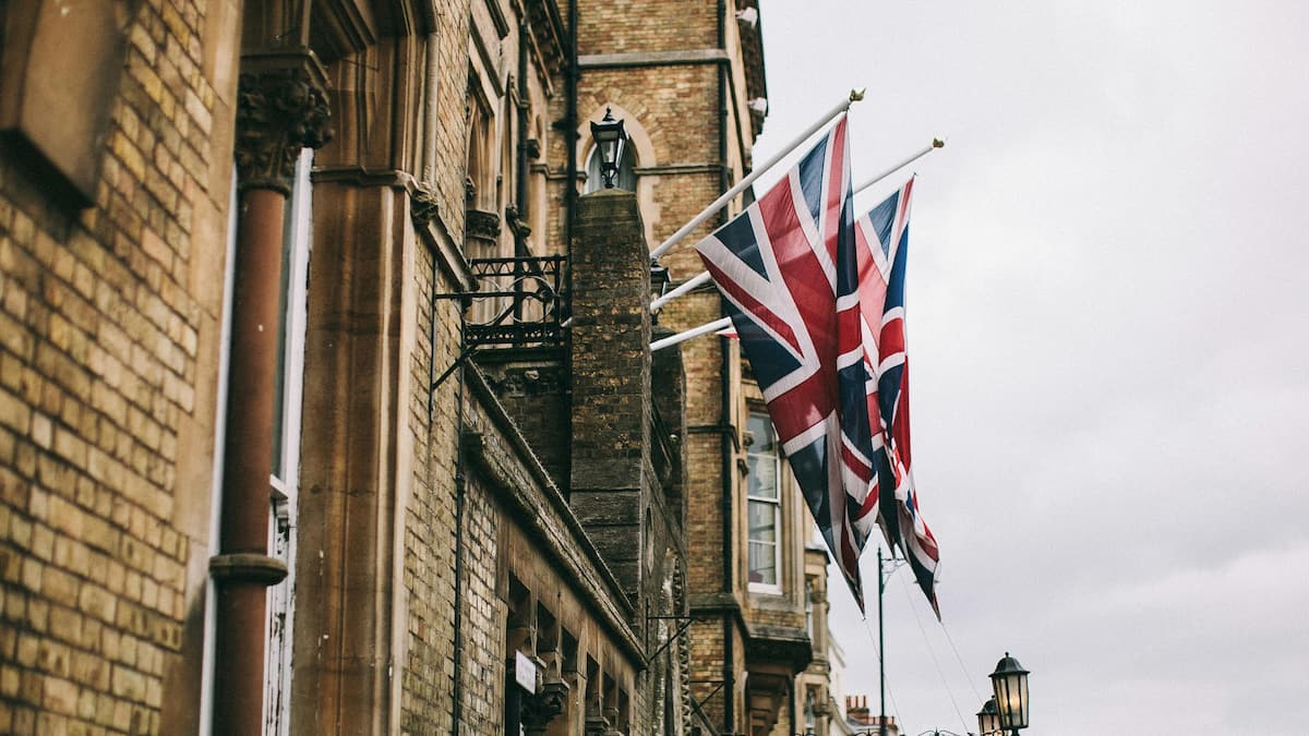 Picture showing hanging UK Flags outside a building.