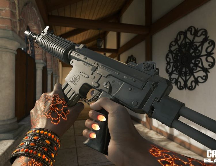 Krig C AR in Black Ops 6, an assault rifle held up by a pair of hands with glowing orange tattoos and nails.