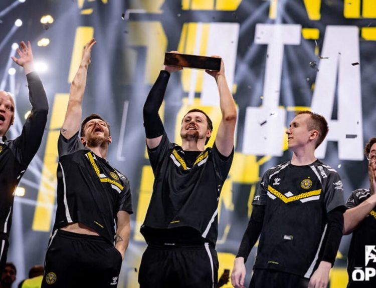 Team Vitality celebrate as mezii lift the trophy after winning a BLAST Open tournament.