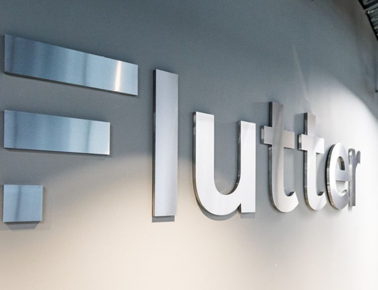 Flutter Entertainment's logo and brand name displayed in the company office.