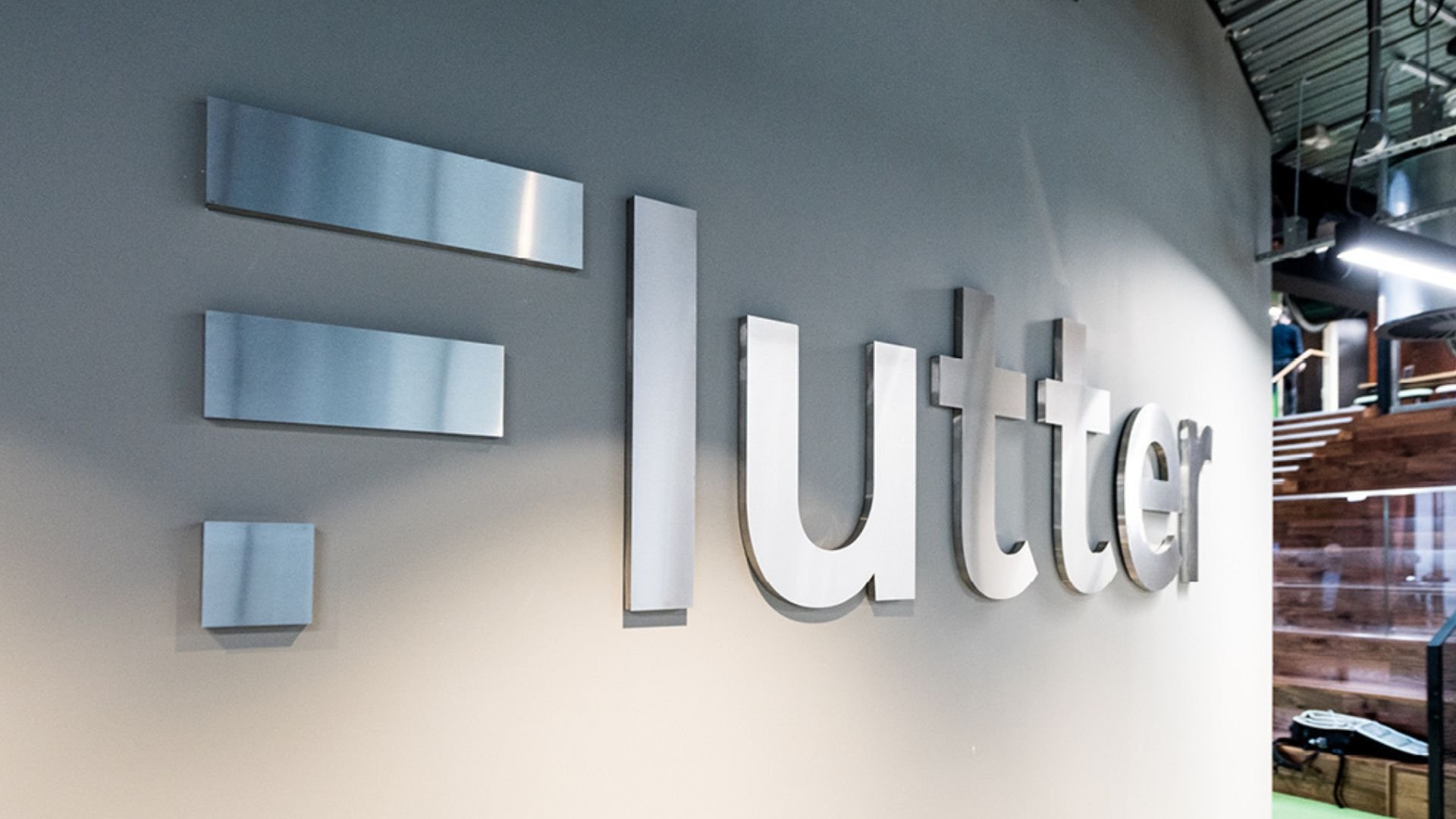 Flutter Entertainment's logo and brand name displayed in the company office.