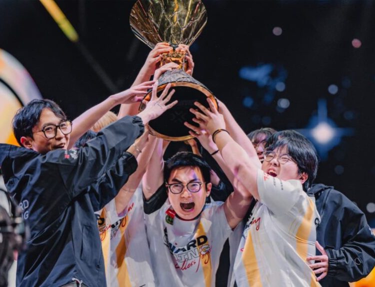 EDward Gaming lift the trophy after winning the VALORANT Champions 2024 tournament.