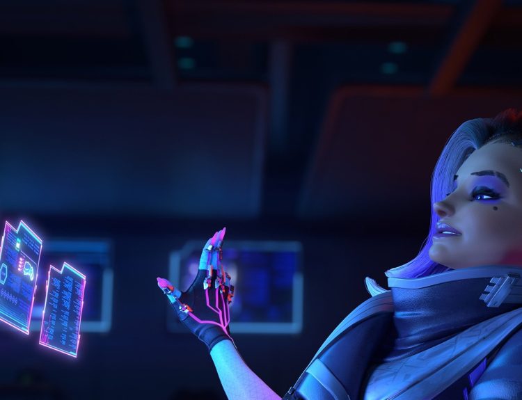 Sombra in Overwatch sitting on front of a hyperfuturistic, holographic PC.