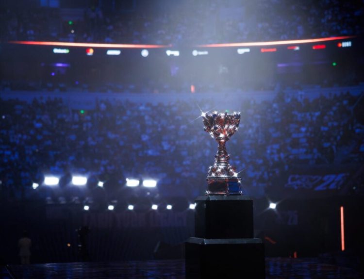 League of Legends Worlds 2025 trophy captured with the crowd in the background